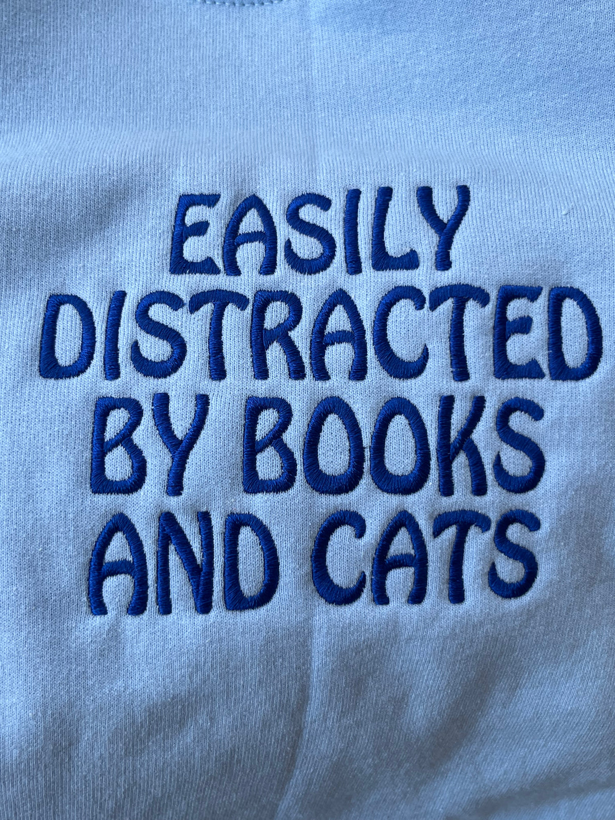 Easily Distracted by Books and Cats