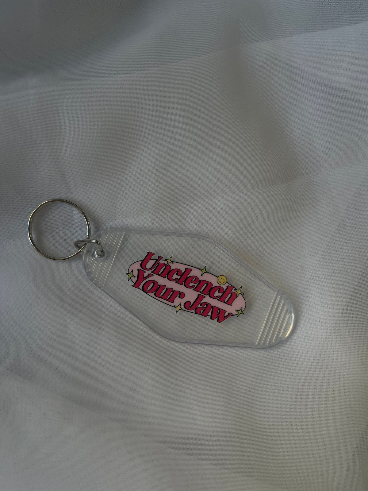 Unclench Your Jaw Motel Keychain